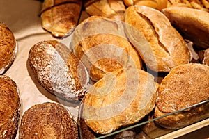 Delicious fresh bread on shelf in bakery