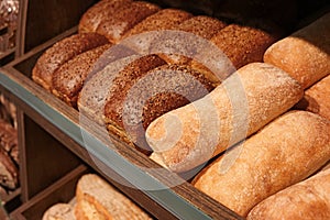 Delicious fresh bread on shelf in bakery