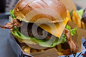 Delicious fresh burger close up. Selective focus with shallow depth of field