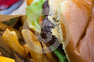 Delicious fresh burger close up. Selective focus with shallow depth of field