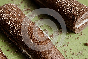 Delicious fresh cheese bread with grains on desk surface