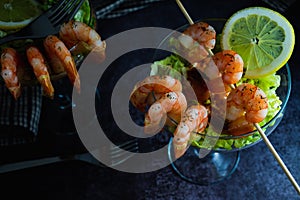 Delicious fresh cooked Shrimp cocktail starter served in a tropical tourist restaurant in a glass with decoration of prawn with