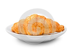 Delicious fresh croissant on a white plate isolated on white bac