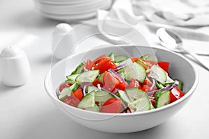Delicious fresh cucumber tomato salad in bowl