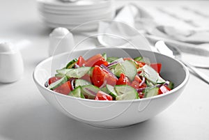 Delicious fresh cucumber tomato salad in bowl