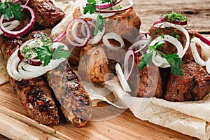 Delicious fresh grilled meat on wooden background