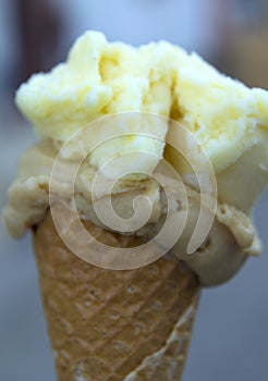 Delicious and fresh ice cream with fruit on the cone