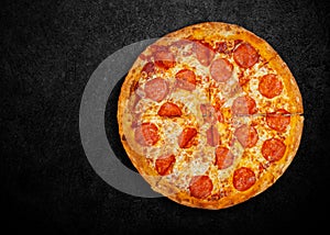 Delicious fresh pizza on dark background