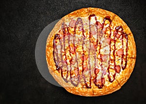 Delicious fresh pizza on dark background