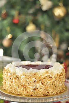 Delicious fresh raspberry hazelnut cake with Christmas decoration