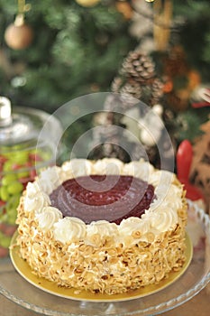 Delicious fresh raspberry hazelnut cake with Christmas decoration