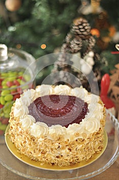 Delicious fresh raspberry hazelnut cake with Christmas decoration