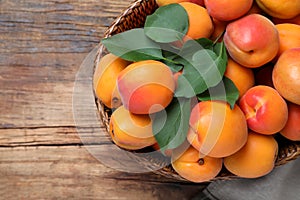 Delicious fresh ripe apricots on wooden table, top view