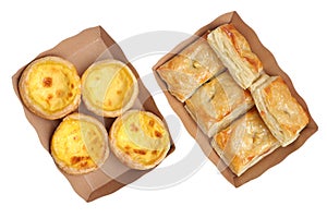 Delicious fresh square butter pie bread and Egg tart in paper tray on a white background .