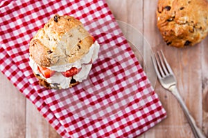 Delicious freshly baked scones with thick cream and jam