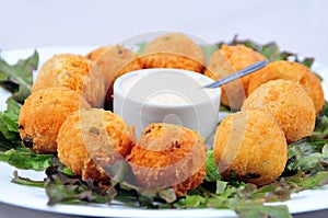 Delicious fried bacalhau potato and cassava dumpling, baked and stuffed with chicken, cheese, olives and cream, kieve