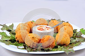 Delicious fried bacalhau potato and cassava dumpling, baked and stuffed with chicken, cheese, olives and cream, kieve photo