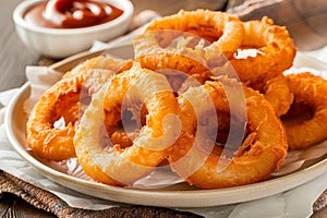 Delicious fried onion rings with dipping sauce