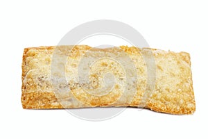 A delicious fried pie from a popular fast food chain. Close-up. Isolated on a white background