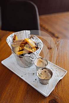 Delicious fried potatoes with sauces