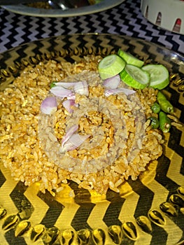 Delicious fried rice with raw shallots and cucumbers and chillies photo
