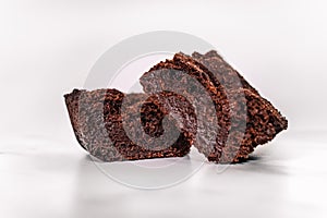 Delicious fudgy cocoa brownies isolated on white background.