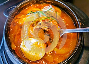 Delicious Gimchi Jjigae  or Kimchi Soup in a hot pot. photo