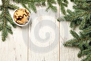 Delicious ginger biscuits. Fir branch. NewYear. Light background