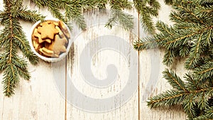 Delicious ginger biscuits. Fir branch. NewYear. Light background