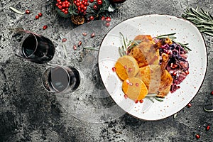 Delicious goose legs served with red cabbage on a festive table. Dish for Christmas Eve. banner, menu, recipe place for text, top