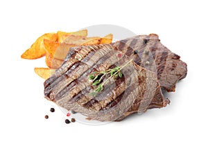 Delicious grilled beef steaks with fried potatoes on white