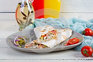 Delicious grilled chicken shawarma sandwich. Wraped in lavash doner kebab