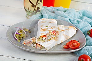 Delicious grilled chicken shawarma sandwich. Wraped in lavash doner kebab