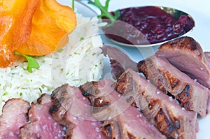 Delicious grilled duck fillets with its garnish