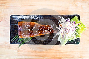 Delicious Grilled Eel on Black Plate