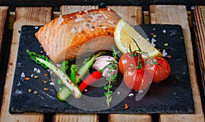 Delicious grilled filet of salmon with green asparagus,