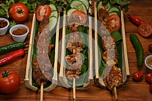 Delicious grilled meat with Sichuan pepper, Chinese spices and vegetable on wooden table