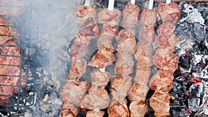 Delicious grilled pork meat in BBQ Barbecue with pork meat. Kebabs on the grill. Close-Up Of Meat On Barbecue Grill With Smoke