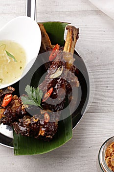 Delicious Grilled Ribs Served with Broth Soup