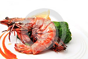 Delicious grilled seafood prawn shrimp food cuisine with broccoli on plate white background