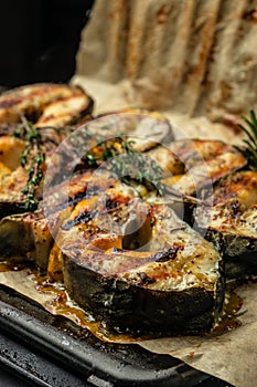 Delicious grilled sturgeon fish steaks. Food recipe background. Close up