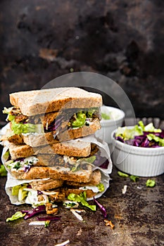 Delicious gyros sandwich in paper bag with salad