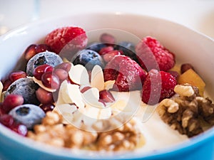 Delicious and healthy breakfast bowl with fruits and nuts