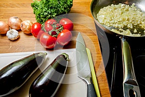 Delicious healthy cooking with eggplant tomato garlic and parsley.