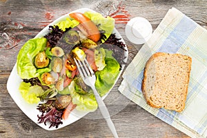 Delicious healthy fresh salad and brussels sprouts