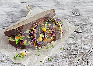 Delicious healthy vegetarian open cole slaw and a chickpea sandwich.