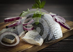 Delicious herring, blue onion parsley snack