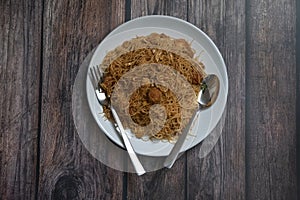 Delicious home-made malay fried noodle on top of ceramic plate