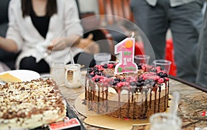 Delicious homemade birthday cake for 1 year old with candle