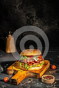 delicious homemade burgers of beef, cheese and vegetables on a wooden board, Hamburger. Fast food concept